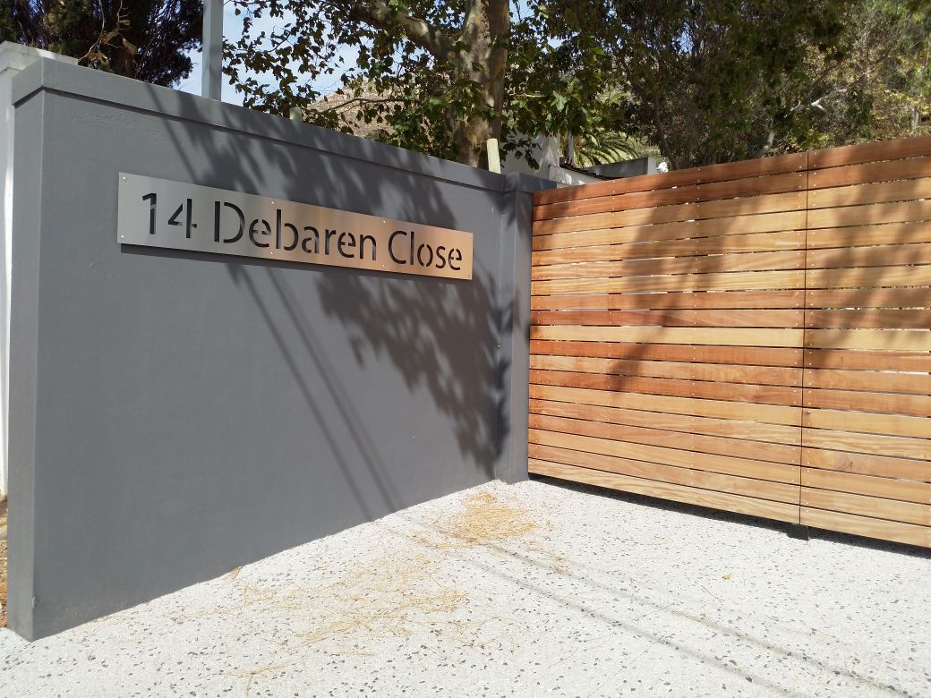 Stainless Steel House Number and Galvanized Mild Steel Gate with Balau Wood, Manufactured and Installed by Sterianos Engineering cc. 