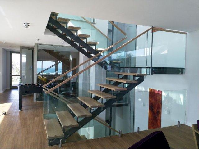 Glass, Wood, Steel Staircase with Glass and Wood Balustrades.