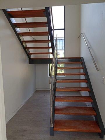 Staircase with Stainless Steel Handrail,
manufactured and installed by Sterianos Engineering cc.