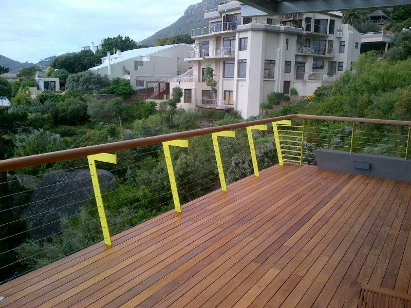 Galvanized mild steel balustrades, painted, with stainless steel wires and a rectangle balau wooden handrail. 