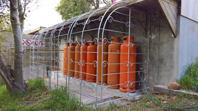 Galvanized mild steel cage for gas bottles. 