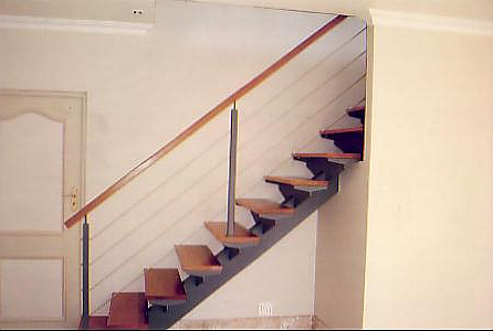 Straight Staircase with Wooden Handrail and Stainless Steel Wires.